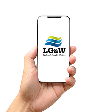male hand holding phone with LGWFCU smart app