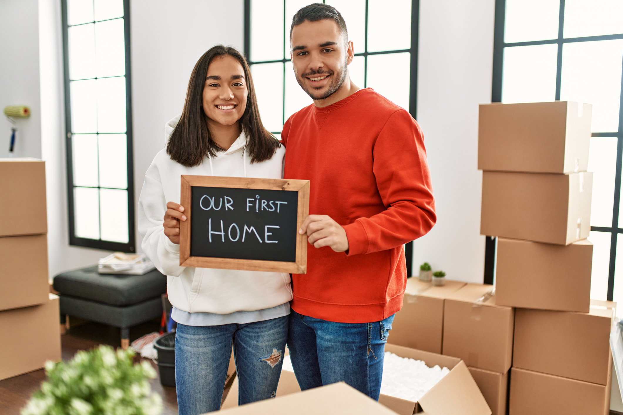 Portrait Of Family Standing Outside House